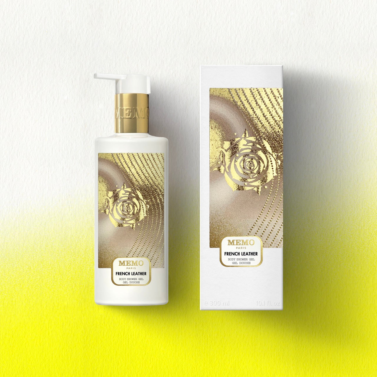 White bottle with gold pump and rose design labeled memo paris french leather shower gel for body care