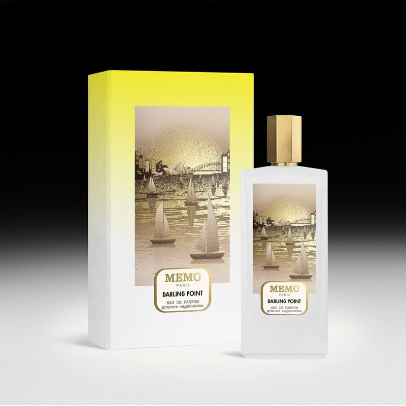 White rectangular perfume bottle with a gold cap and label featuring an illustration of sailboats on water, paired with its matching yellow-to-white gradient box.